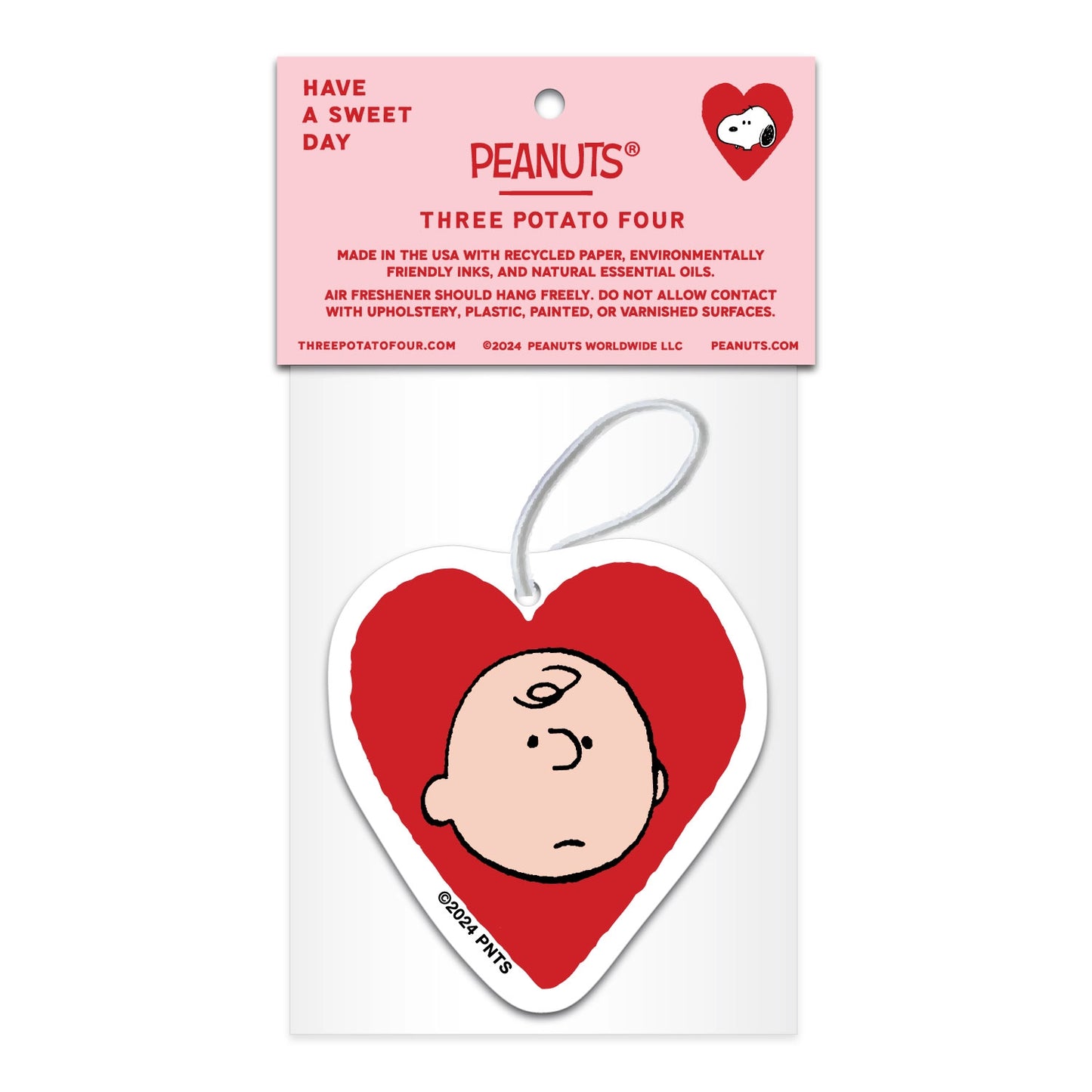 Back view of heart-shaped Peanuts air freshener featuring Charlie Brown illustration. Lavender scent with sustainable materials and eco-friendly packaging.