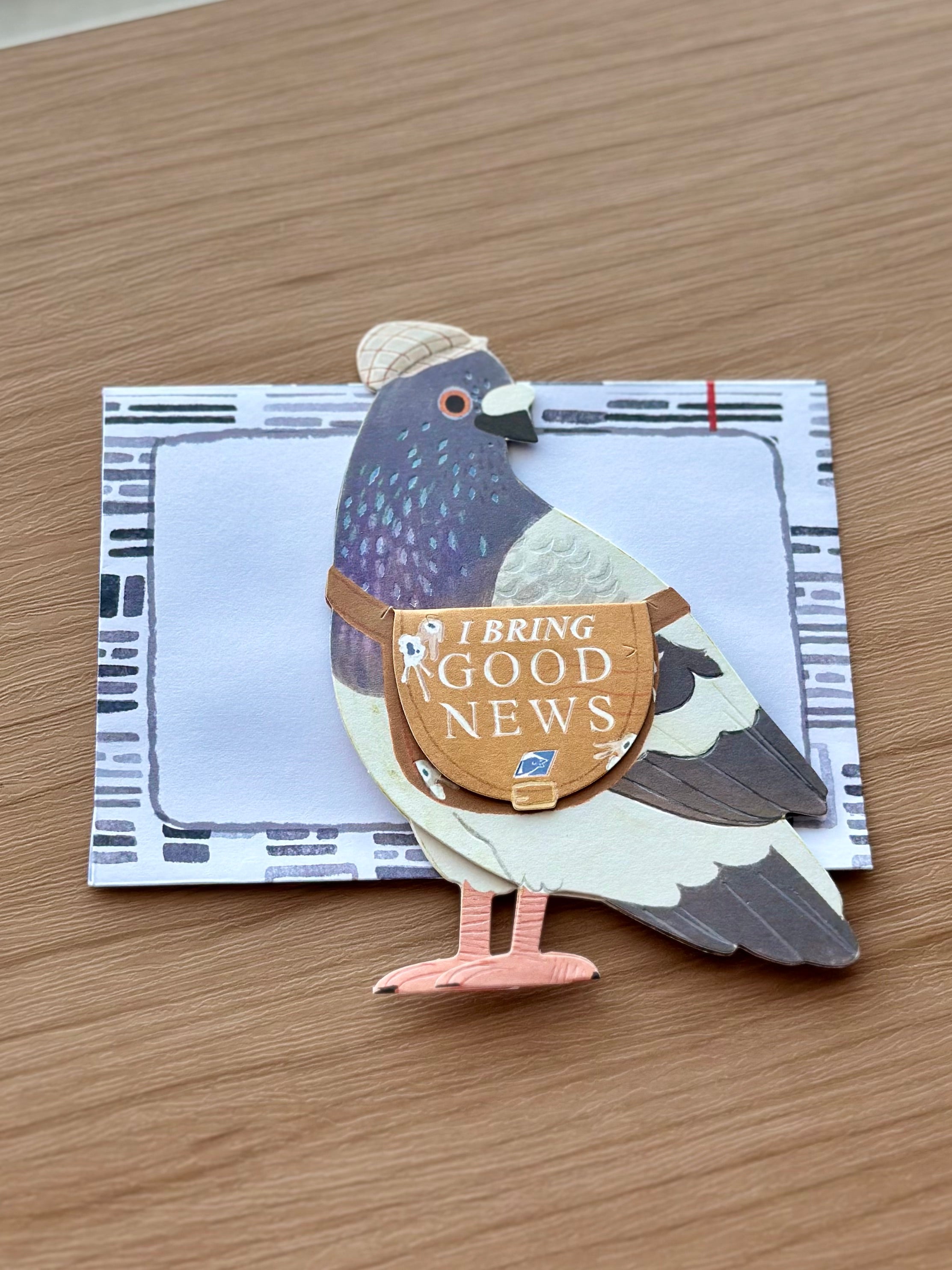 Funny 3D pigeon pop-up card carrying messenger bag with “I Bring Good News.”