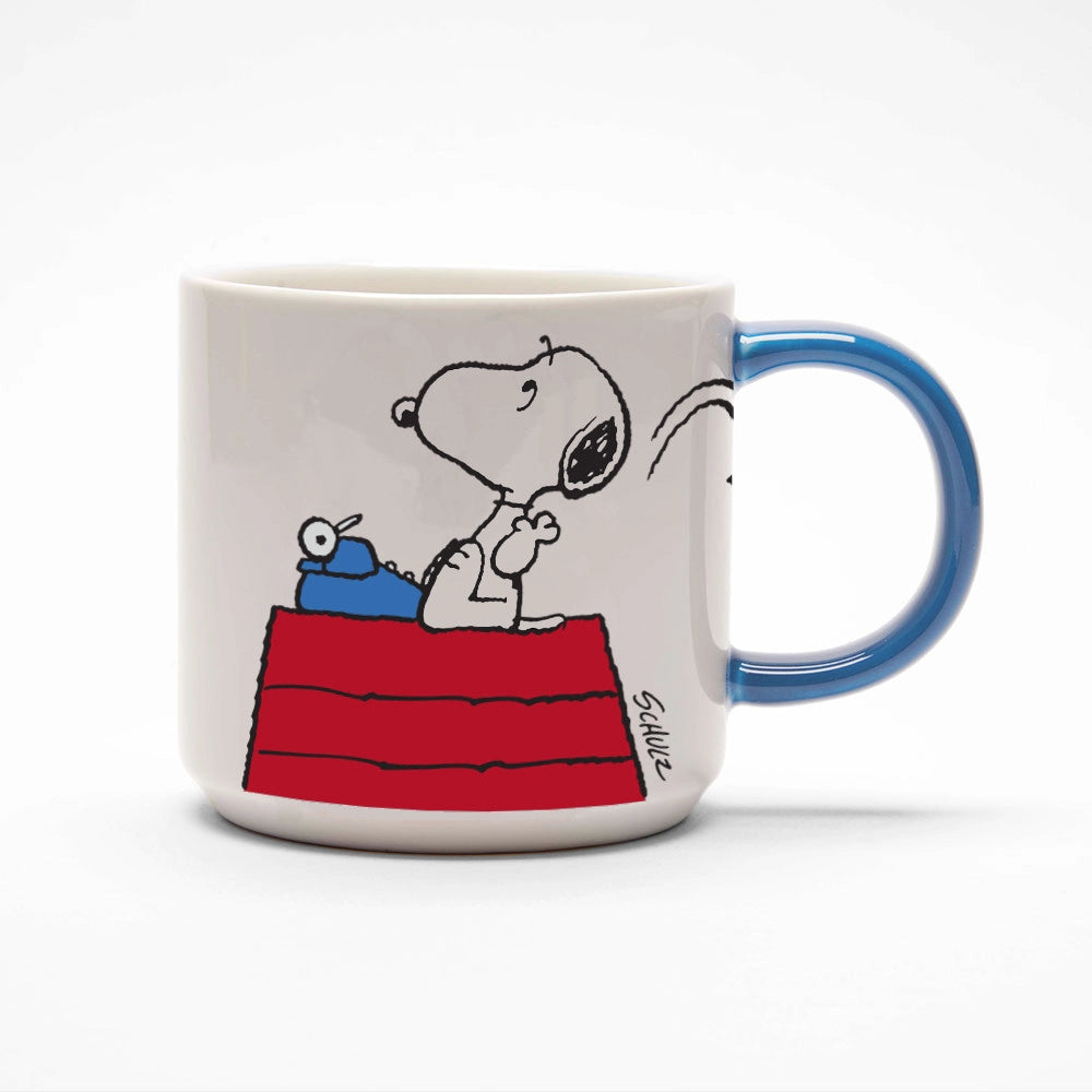 Close-up of the Snoopy “Genius at Work” mug with blue handle and typewriter design