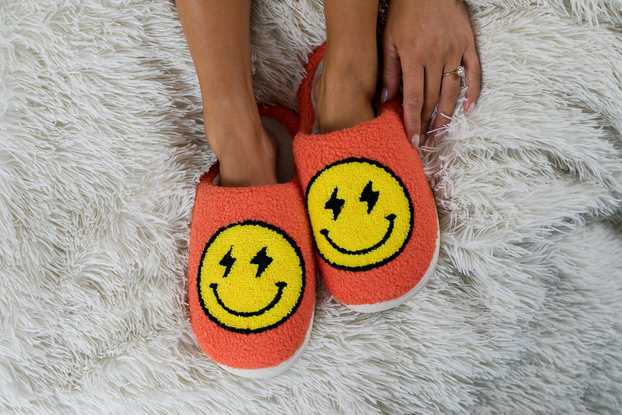 Cozy Smiley Face Slippers – Orange Fuzzy House Shoes with Lightning Eyes (Indoor/Outdoor Soles)