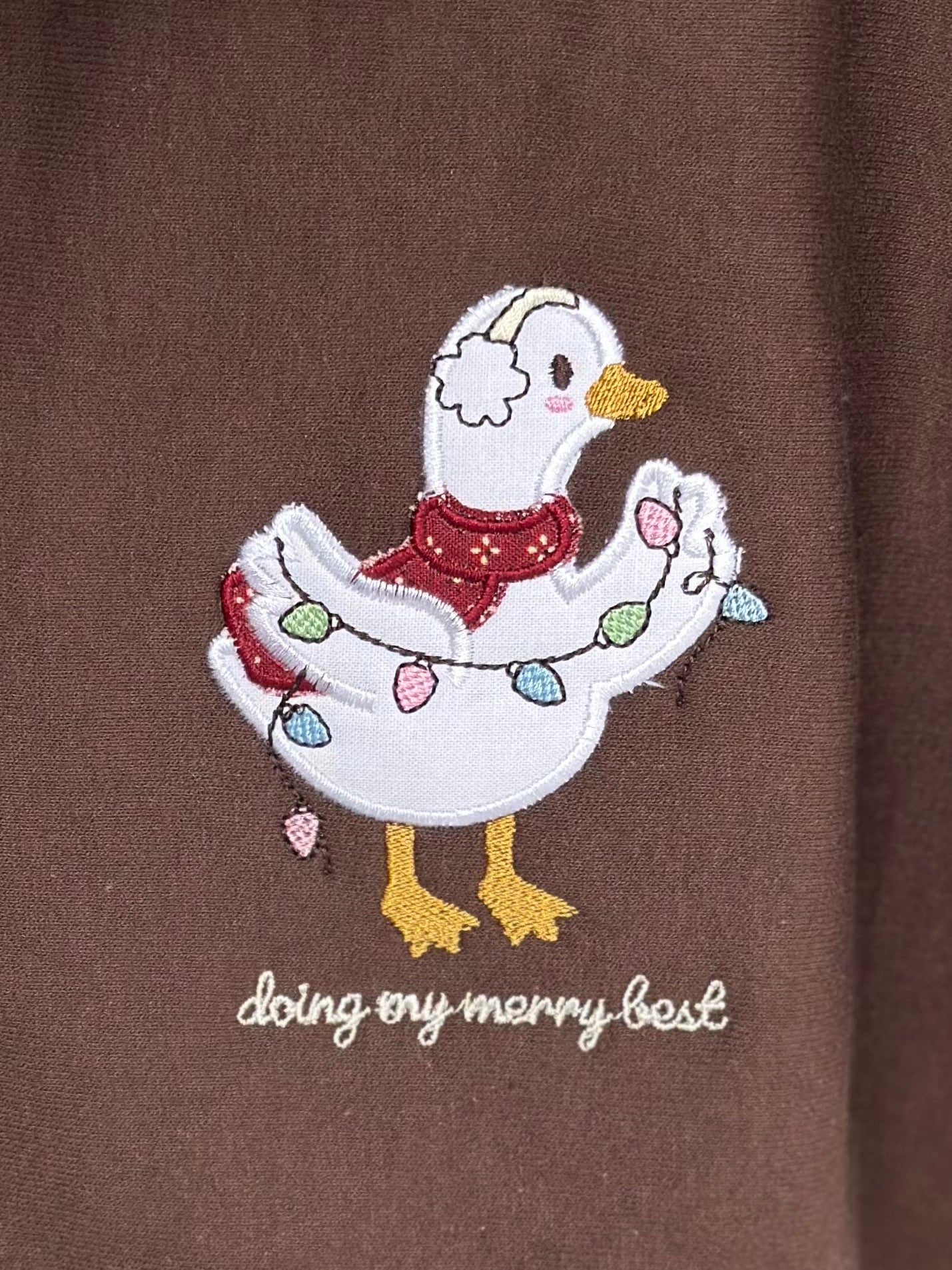 Silly Goose “Doing My Merry Best” Embroidered Christmas Sweatshirt – Brown