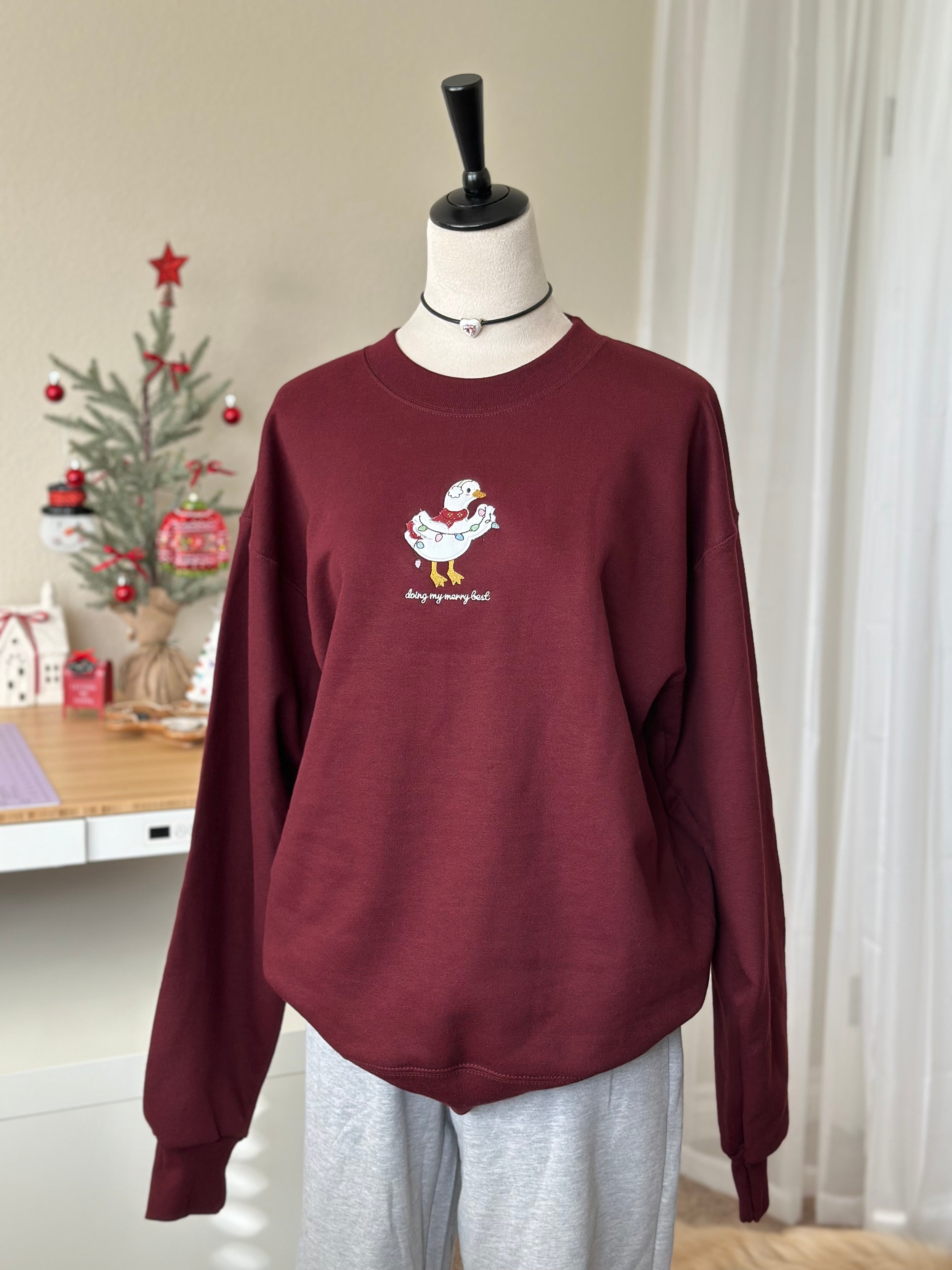 Silly Goose “Doing My Merry Best” Christmas Sweatshirt – Cozy Embroidered Holiday Gift (Burgundy)