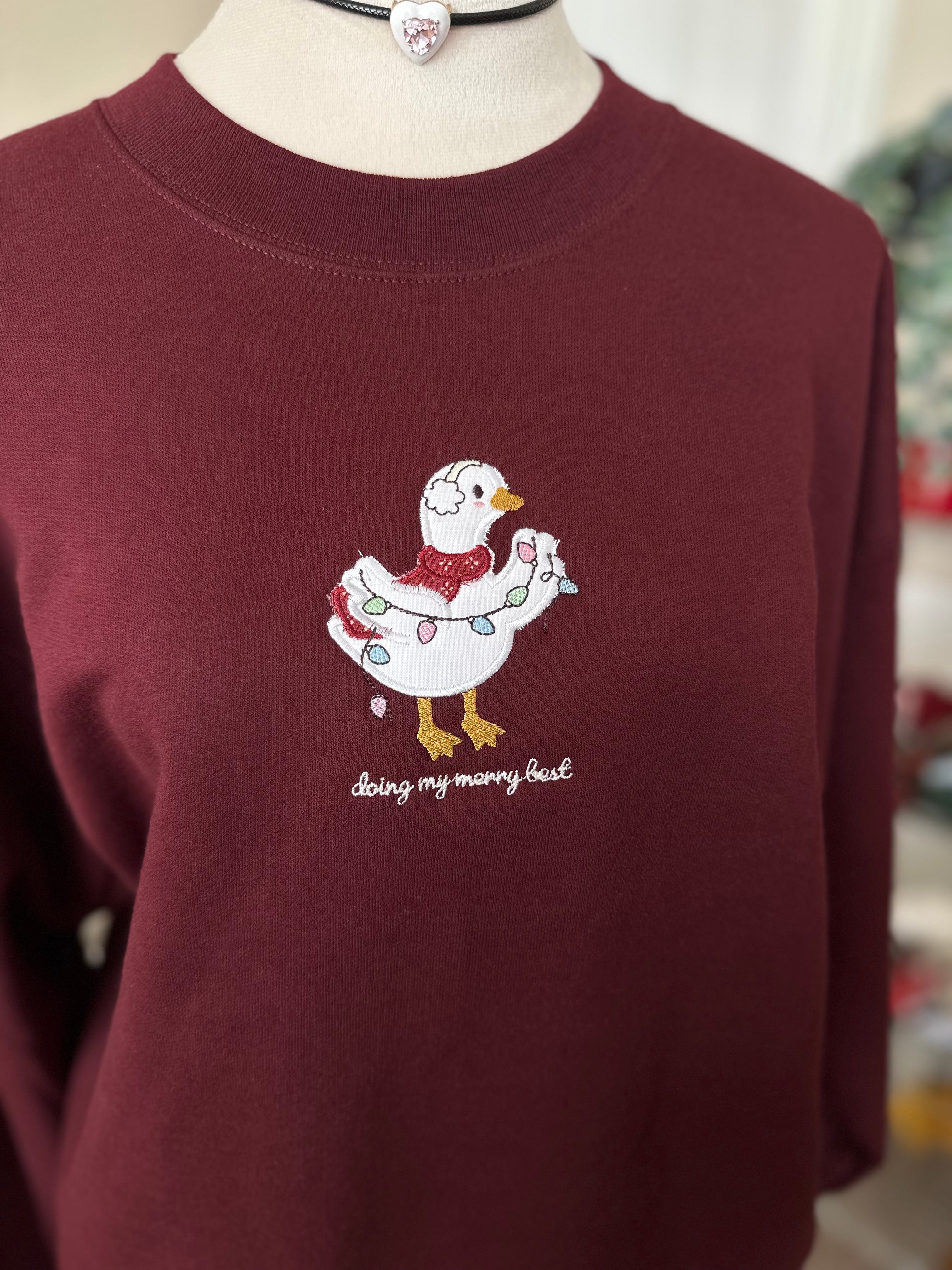 Silly Goose “Doing My Merry Best” Christmas Sweatshirt – Cozy Embroidered Holiday Gift (Burgundy)