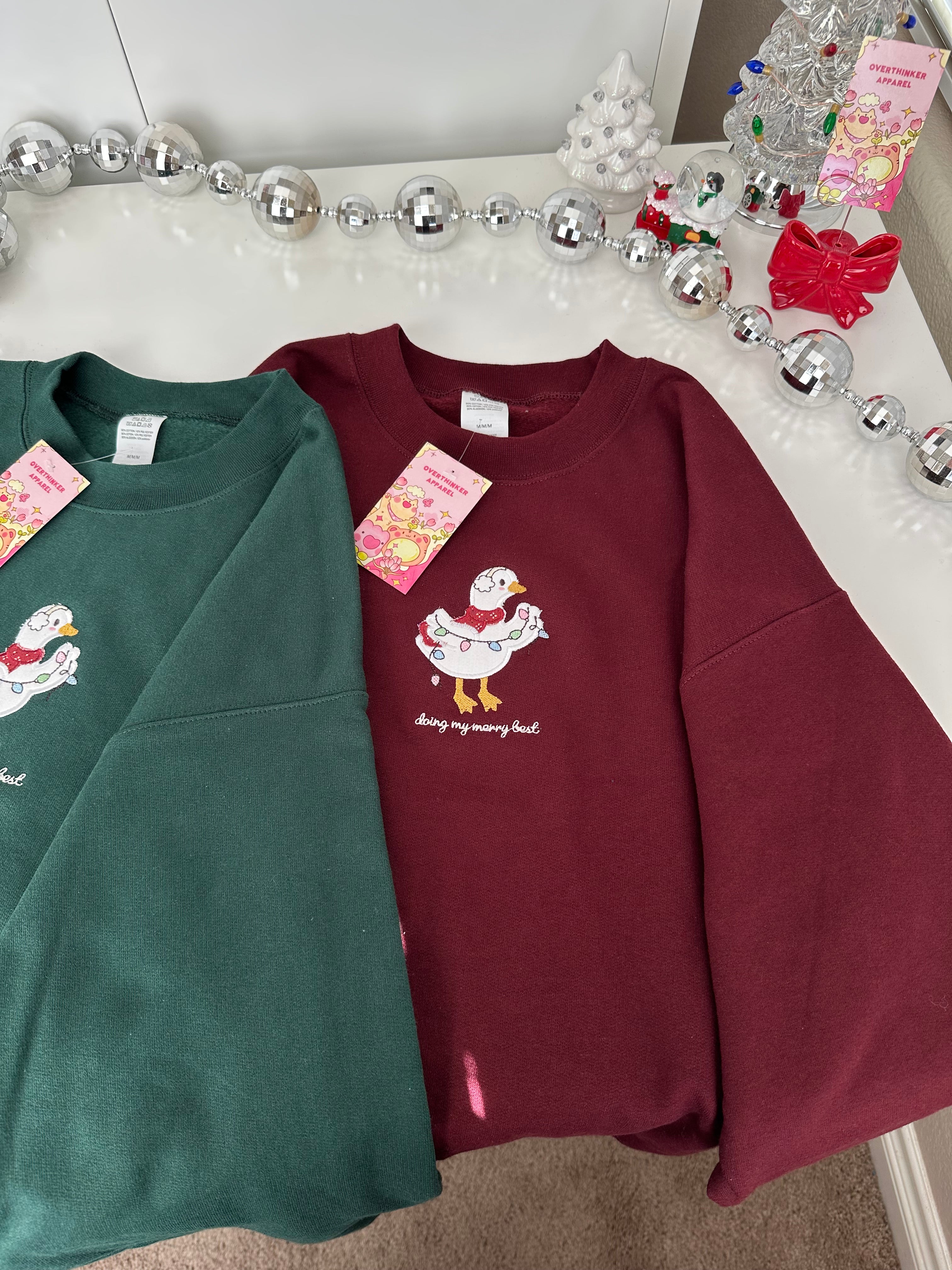 Silly Goose “Doing My Merry Best” Christmas Sweatshirt – Cozy Embroidered Holiday Gift (Burgundy)