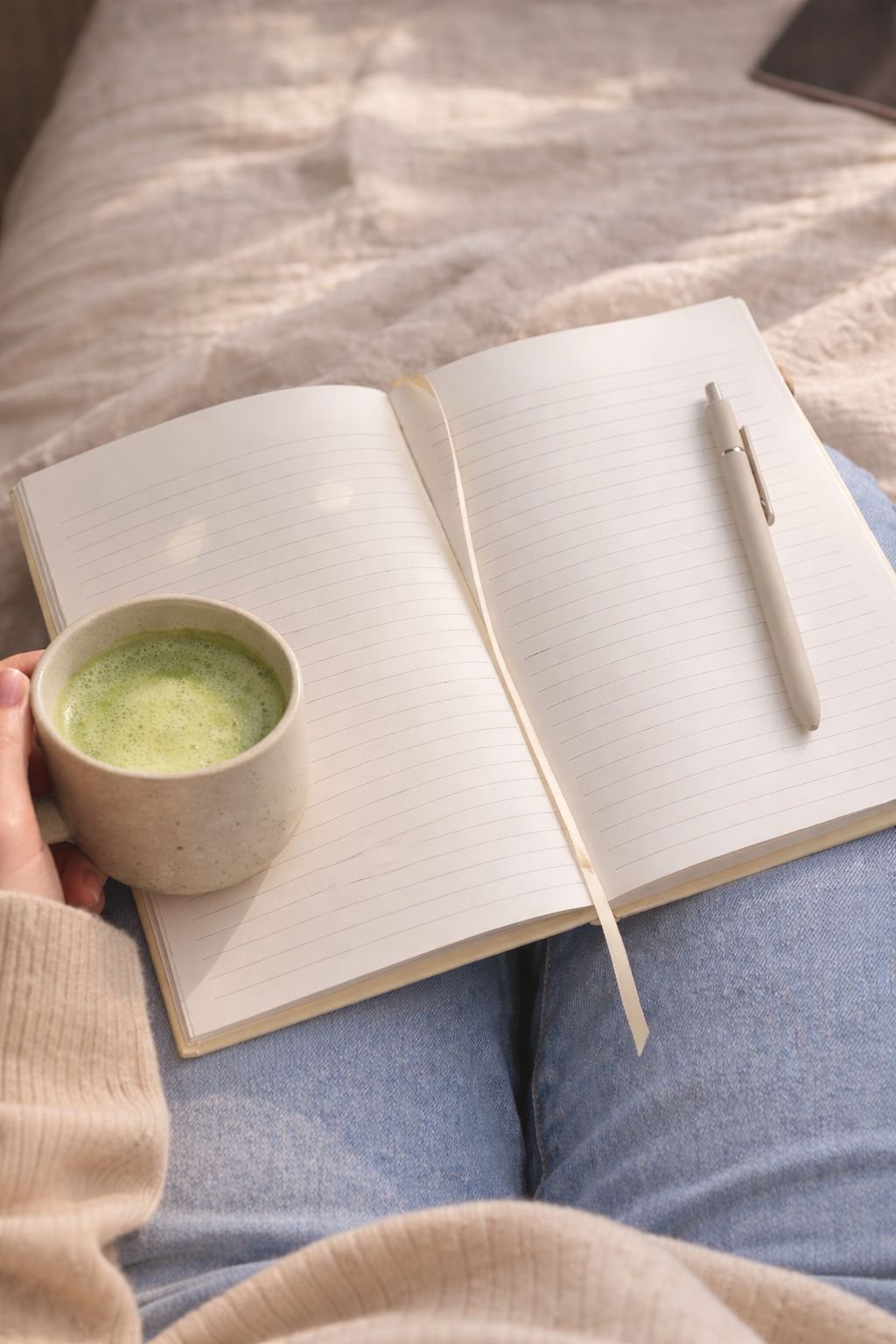 Open A5 lined strawberry journal with cream paper and ribbon bookmark styled with matcha latte, aesthetic notebook for journaling, study notes, and cozy writing routines.