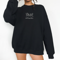 Oversized black sweatshirt with “Always There For You” bear graphic, shown on a standing model against a white background.
