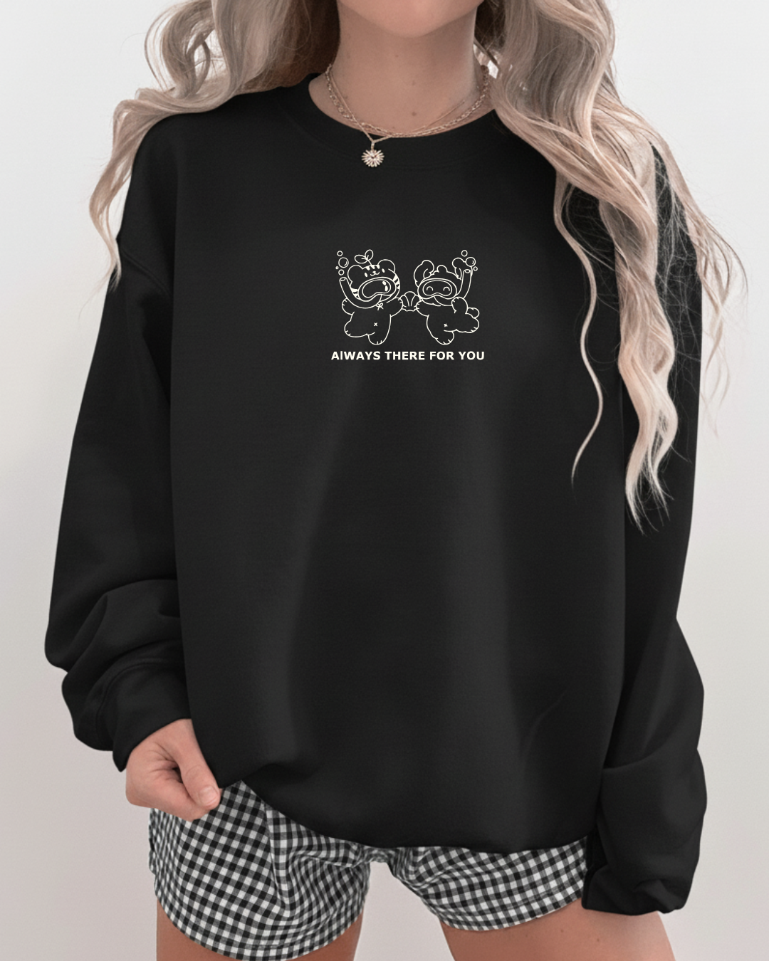 Black oversized crewneck sweatshirt featuring a minimal embroidered design of two characters and the words “always there for you”