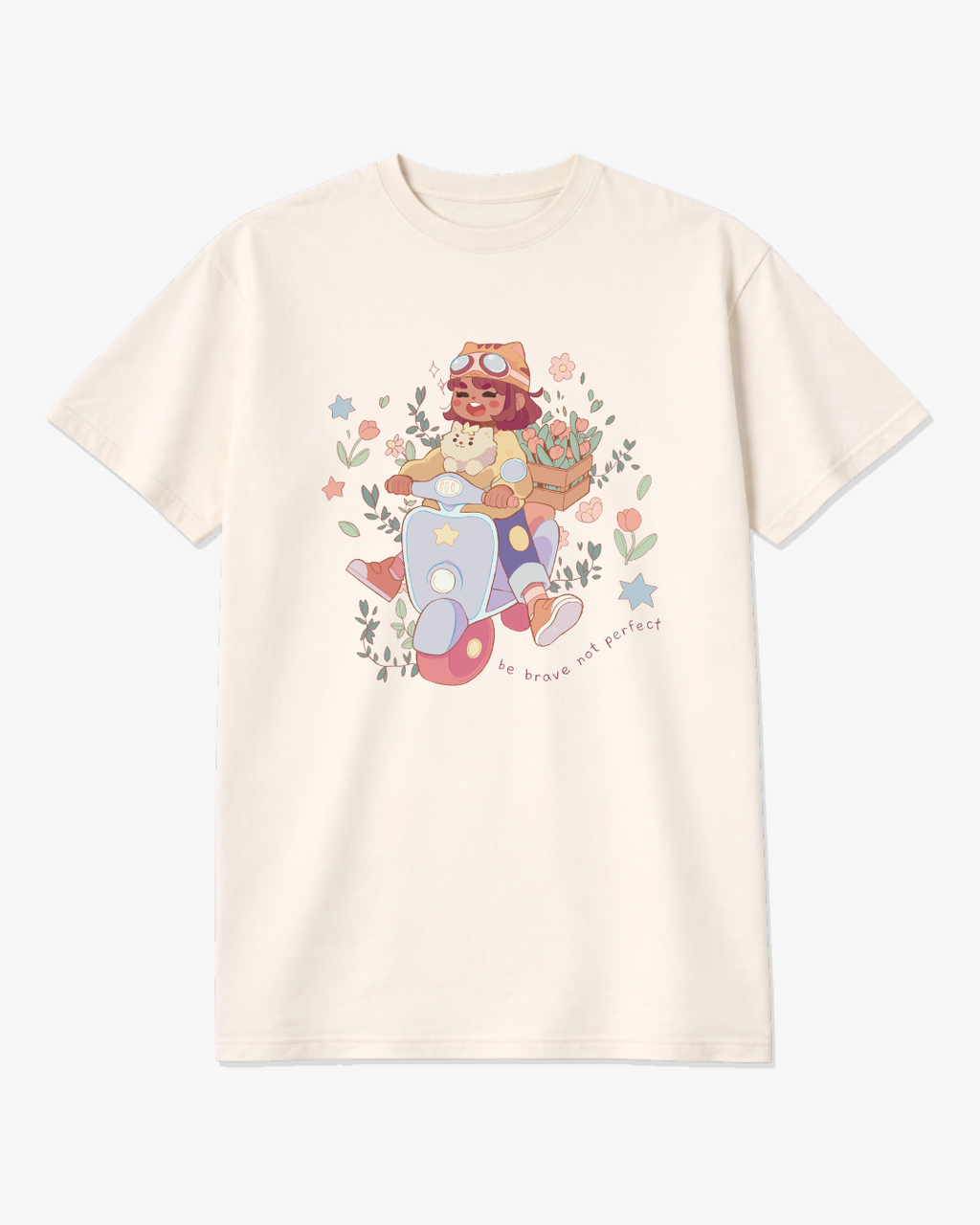 Ivory unisex graphic tee featuring a whimsical illustration of a girl riding a scooter with her dog and the phrase “Be Brave, Not Perfect,” a soft motivational shirt for creatives and overthinkers.