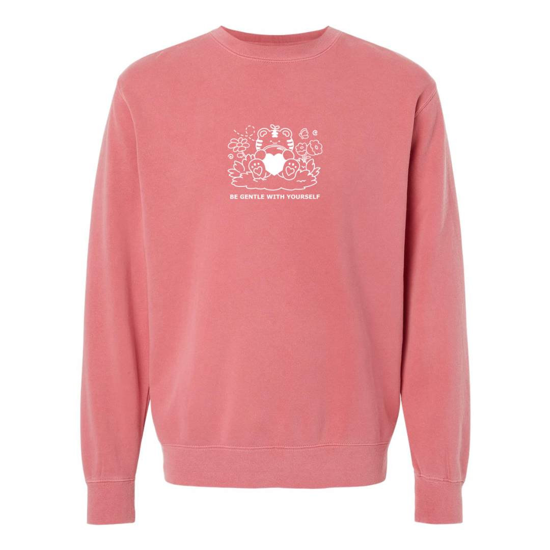 Rose pink embroidered crewneck sweatshirt with a small tiger holding a heart and the words “Be Gentle With Yourself” stitched on the chest