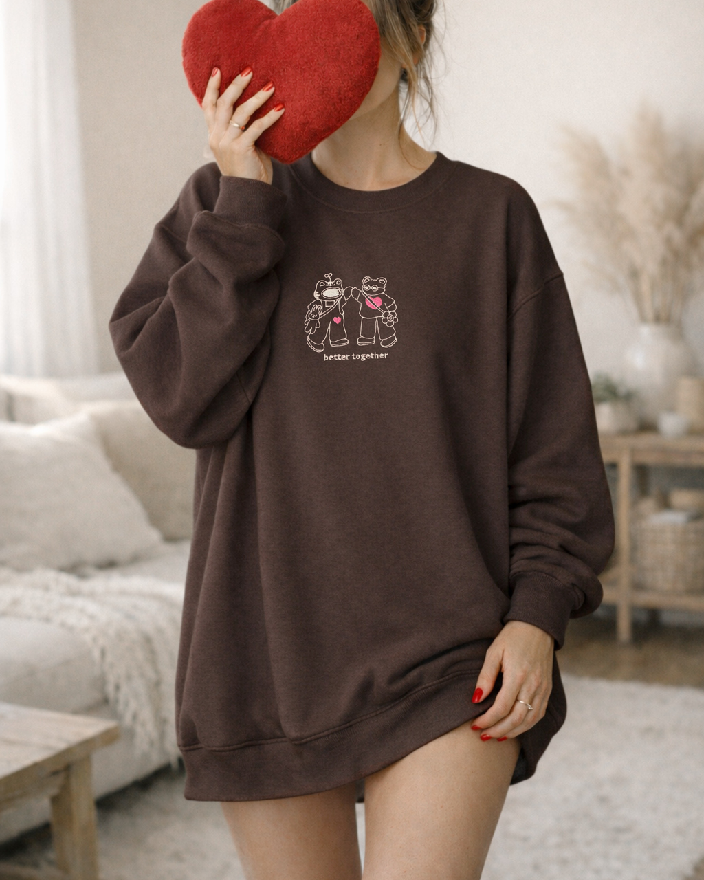 Oversized brown embroidered sweatshirt with “Better Together” text, styled for a cozy, comforting everyday look.