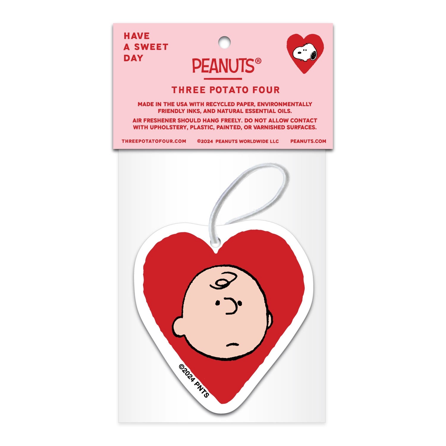 Back view of heart-shaped Peanuts air freshener featuring Charlie Brown illustration. Lavender scent with sustainable materials and eco-friendly packaging.