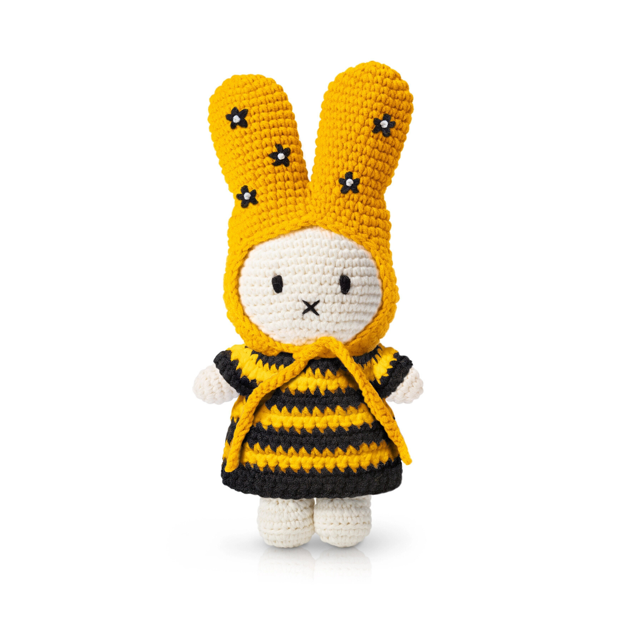 Handmade crochet bunny doll dressed in a bee-inspired outfit with yellow and black stripes and embroidered flowers on the ears — a playful plush toy full of spring charm.