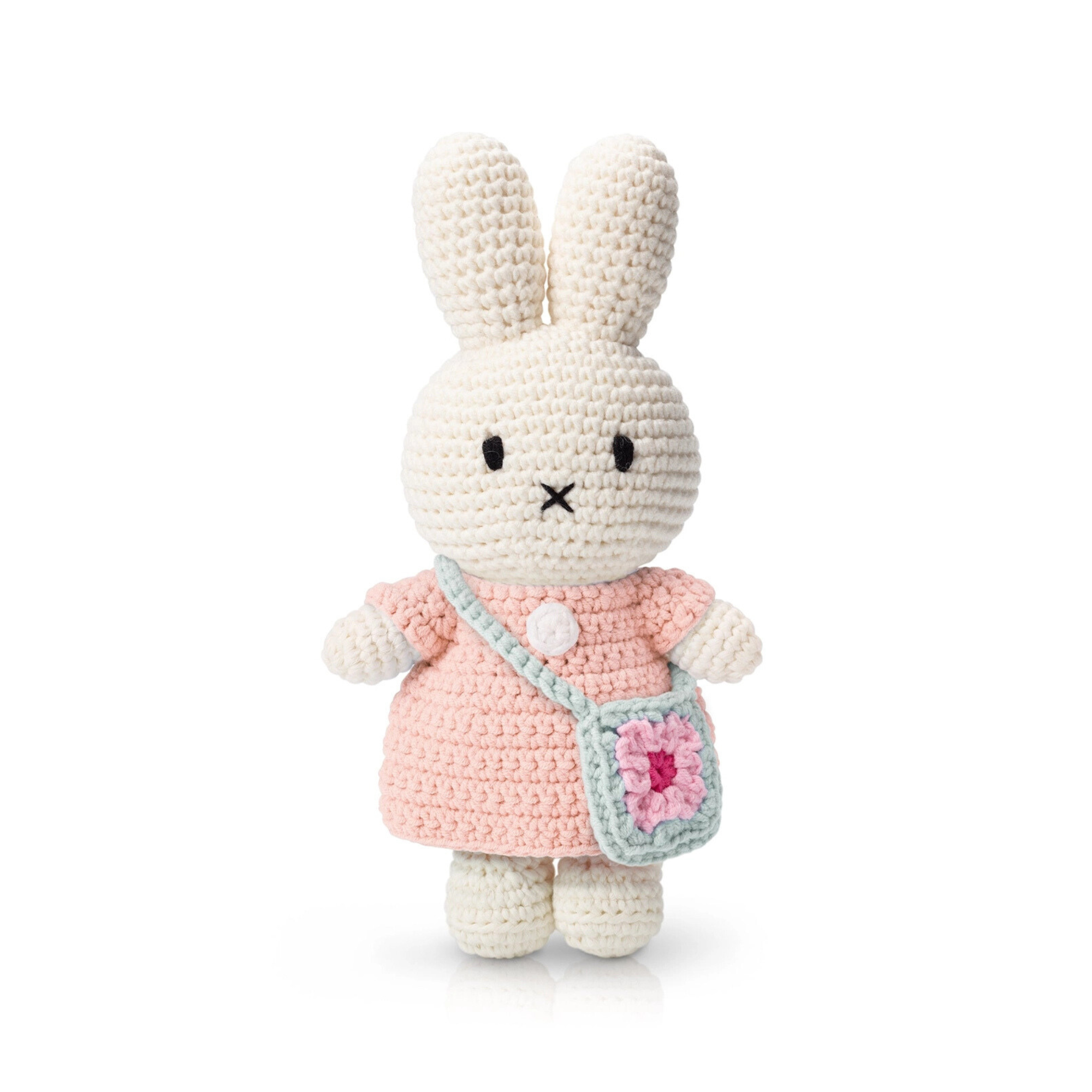 Soft crochet bunny doll in a pastel pink dress with a tiny granny square crossbody bag — an adorable and cozy handmade toy perfect for gentle gifting or nursery decor.