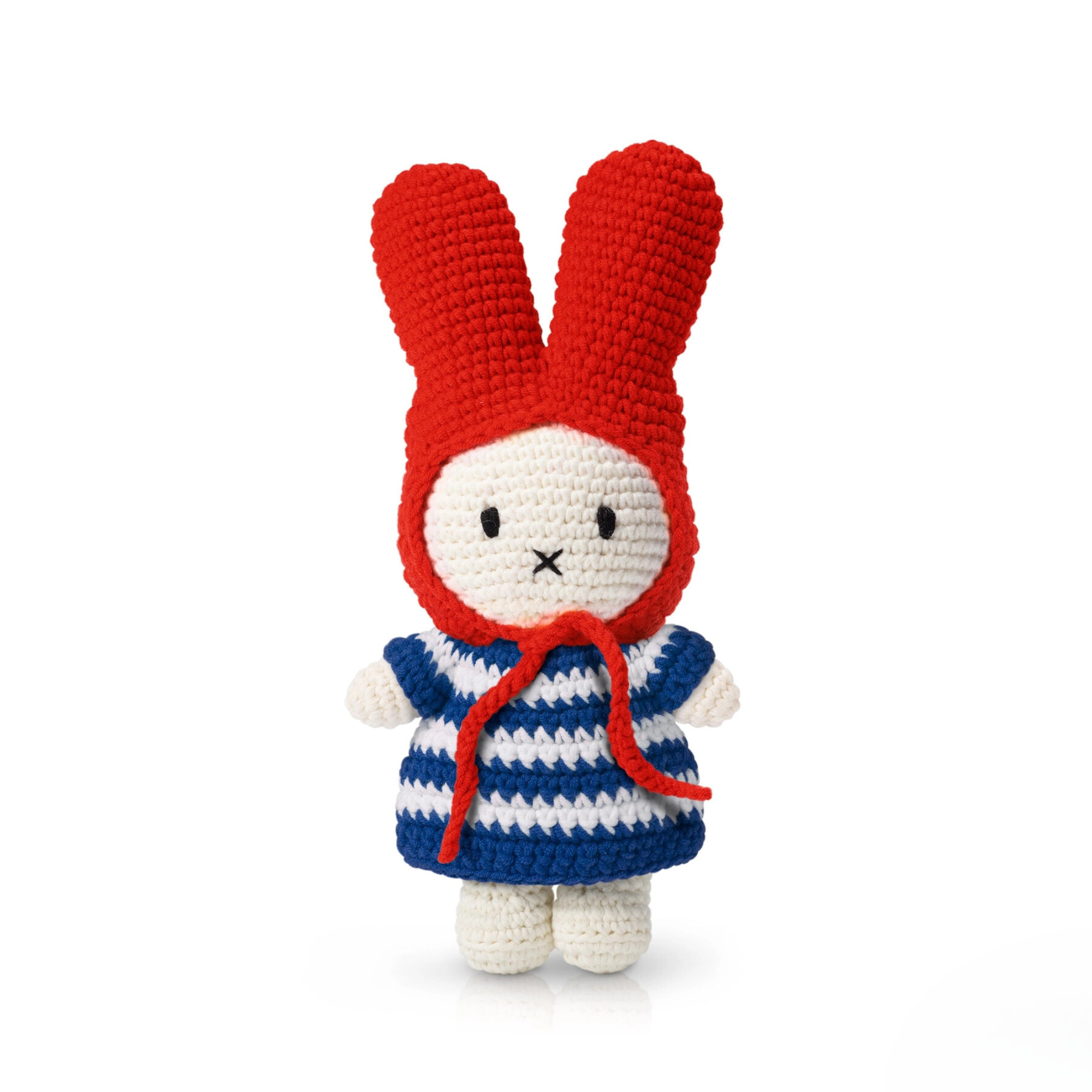 Crocheted bunny doll wearing a red bonnet and blue-and-white striped dress — cozy and charming handmade toy for gentle-hearted gift-giving.