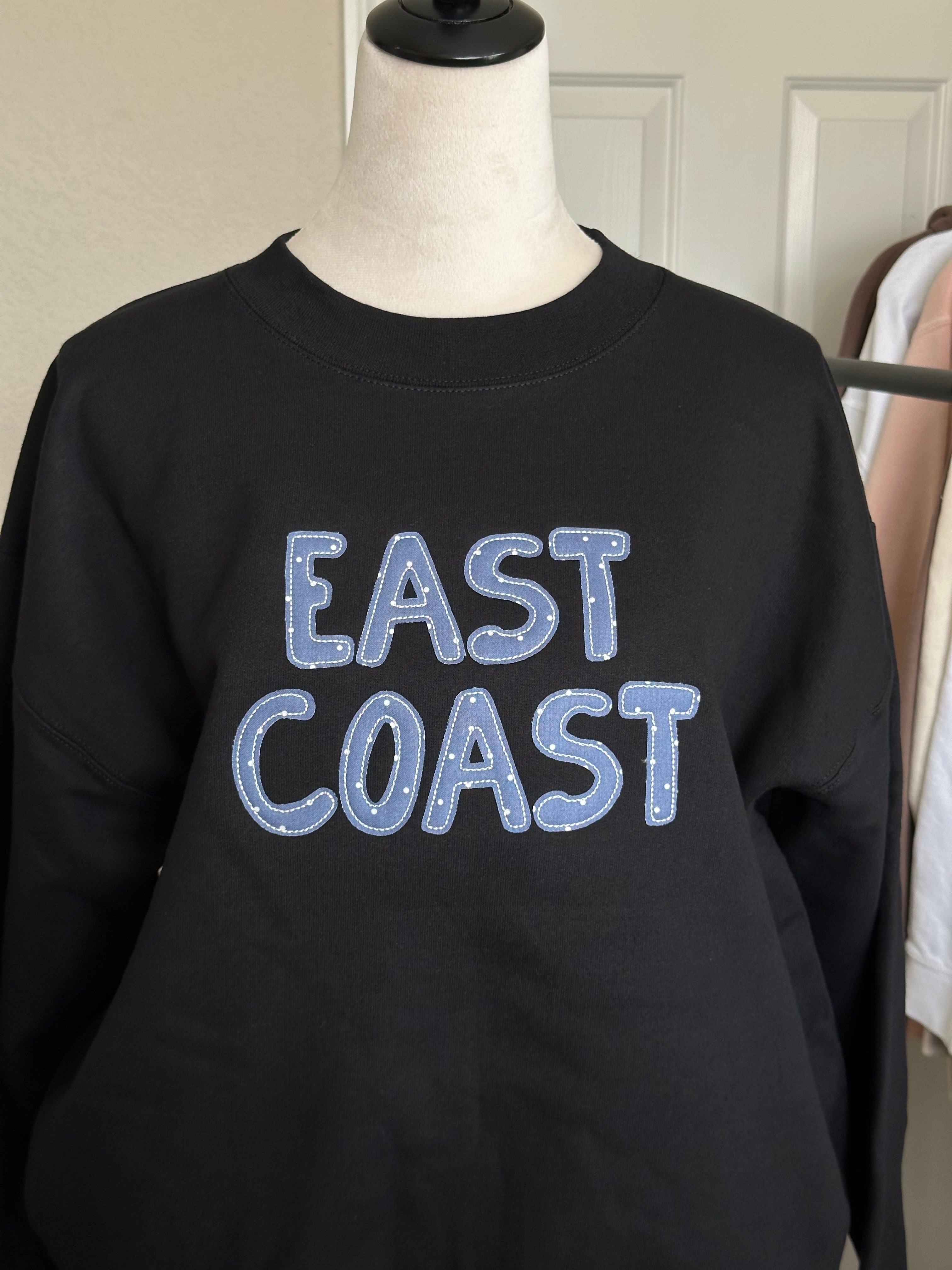 front view of east coast oversized sweatshirt on mannequin relaxed fit minimal casual style