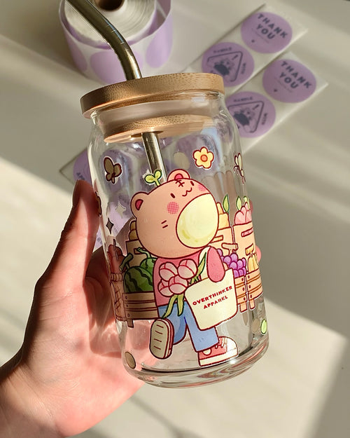 Reusable glass can with bamboo lid and straw for matcha or iced drinks