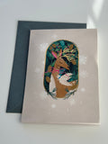 Festive deer Christmas card with gold foil and spruce envelope, snowflake accents.