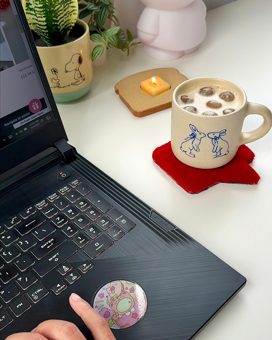 Toast candle styled next to iced coffee on desk with cozy summer setup