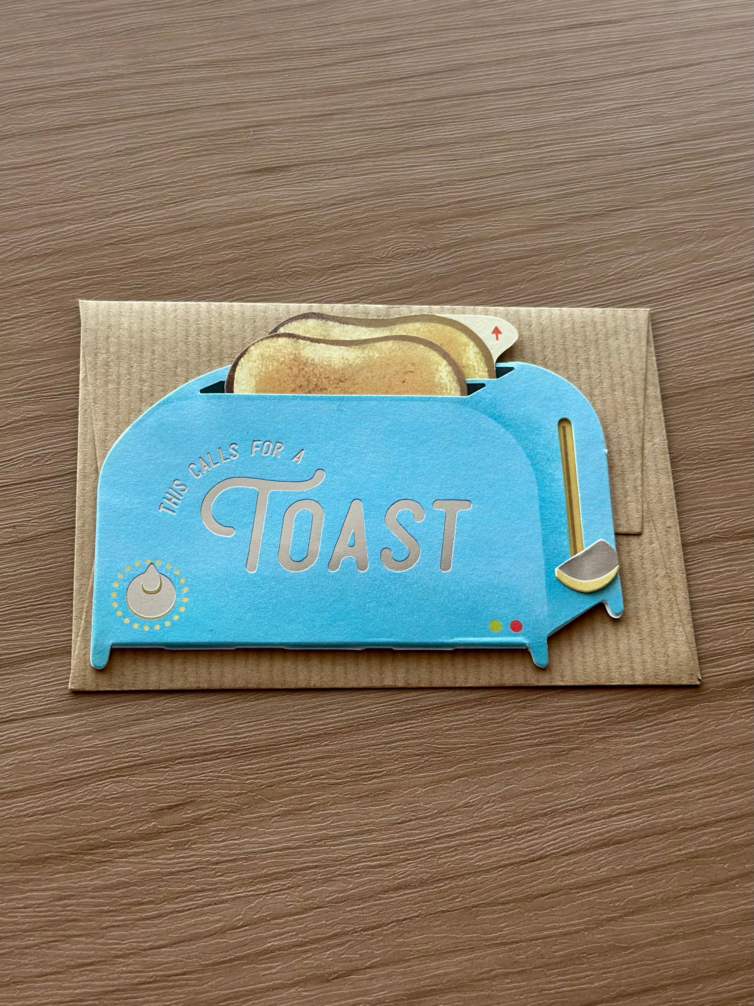 Cute toaster greeting card with interactive pull-tab toast – “This calls for a toast” pun card for celebrations.