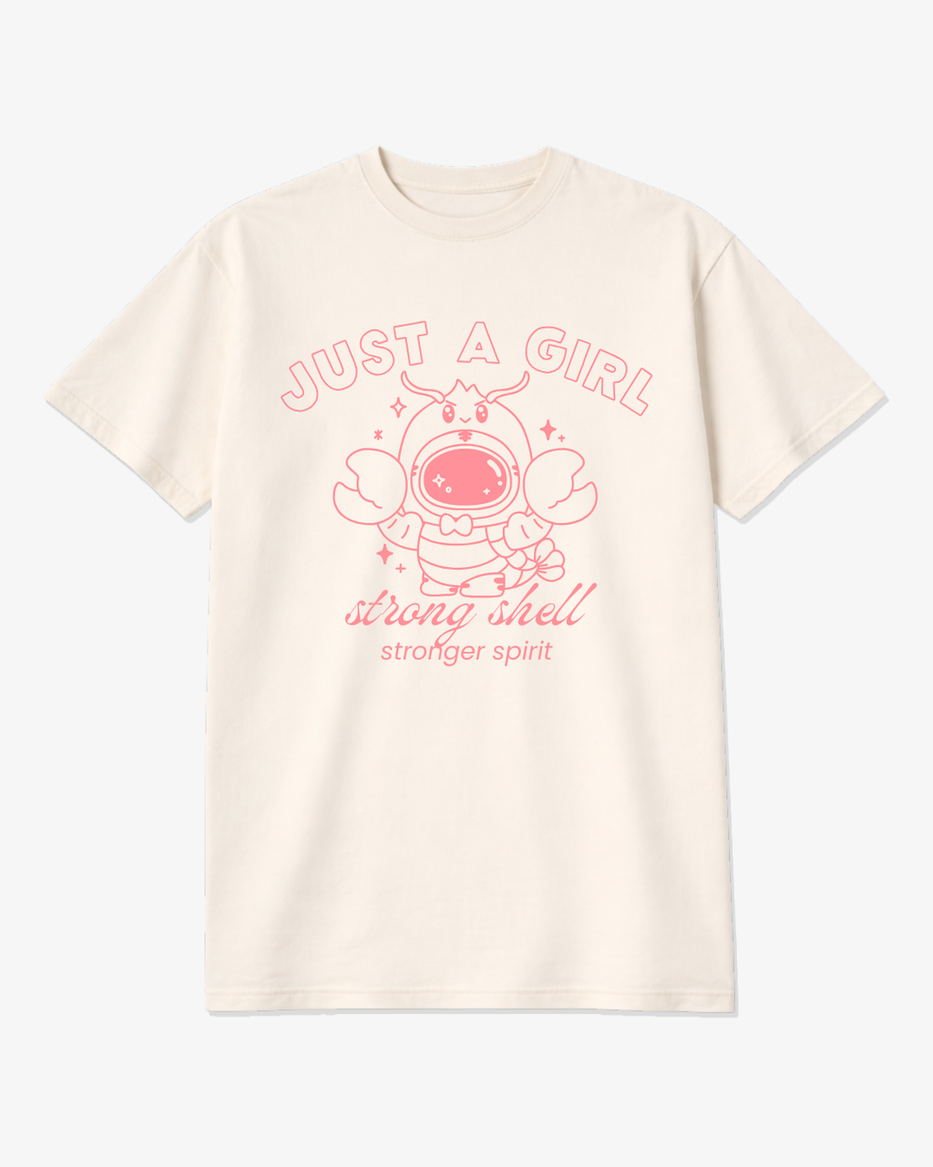 Ivory unisex graphic tee featuring a pink lobster astronaut with the phrase “Just a Girl – Strong Shell, Stronger Spirit,” a soft coastal-inspired shirt for strong women.
