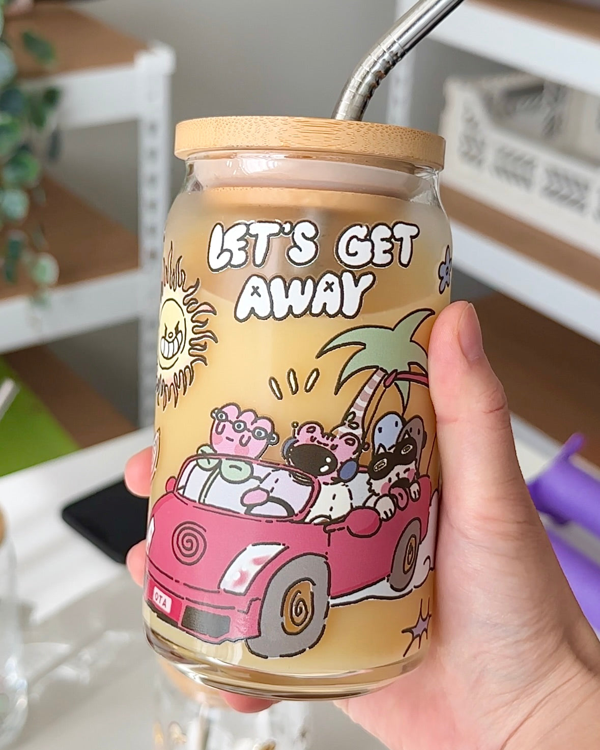 Glass can with bamboo lid and reusable straw for cold drinks

