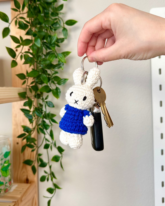 Handmade Miffy plush keychain in blue used as aesthetic bag charm