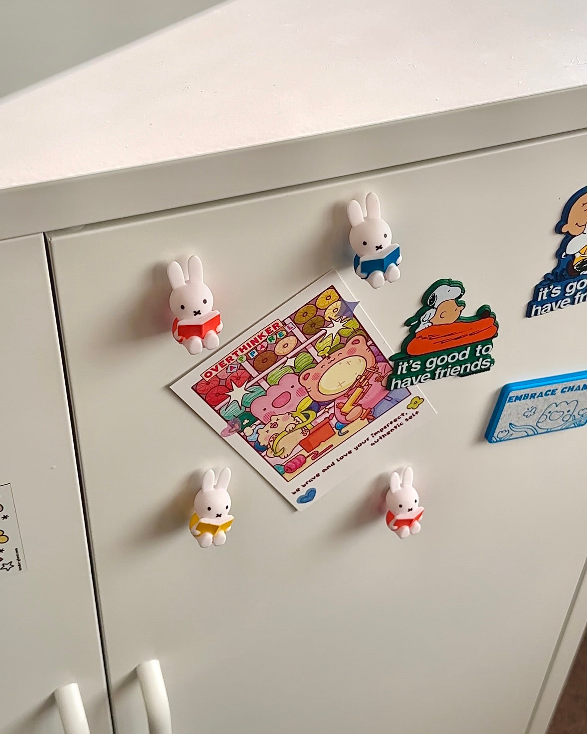 Miffy reading magnets holding notes on a fridge, colorful Miffy book magnets used in a cozy kitchen setup