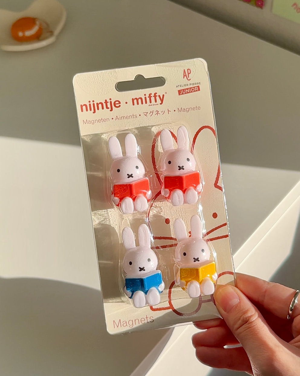 Official Miffy reading magnets set displayed in packaging with soft natural light, four colorful Miffy book magnets