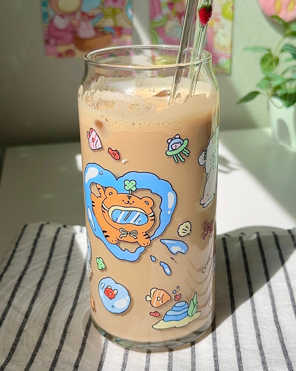 Ocean Playground iced coffee glass with snorkeling tiger and jellyfish design