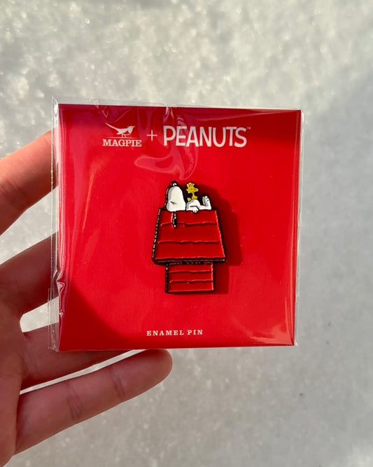 Snoopy enamel pin lounging with Woodstock on red doghouse