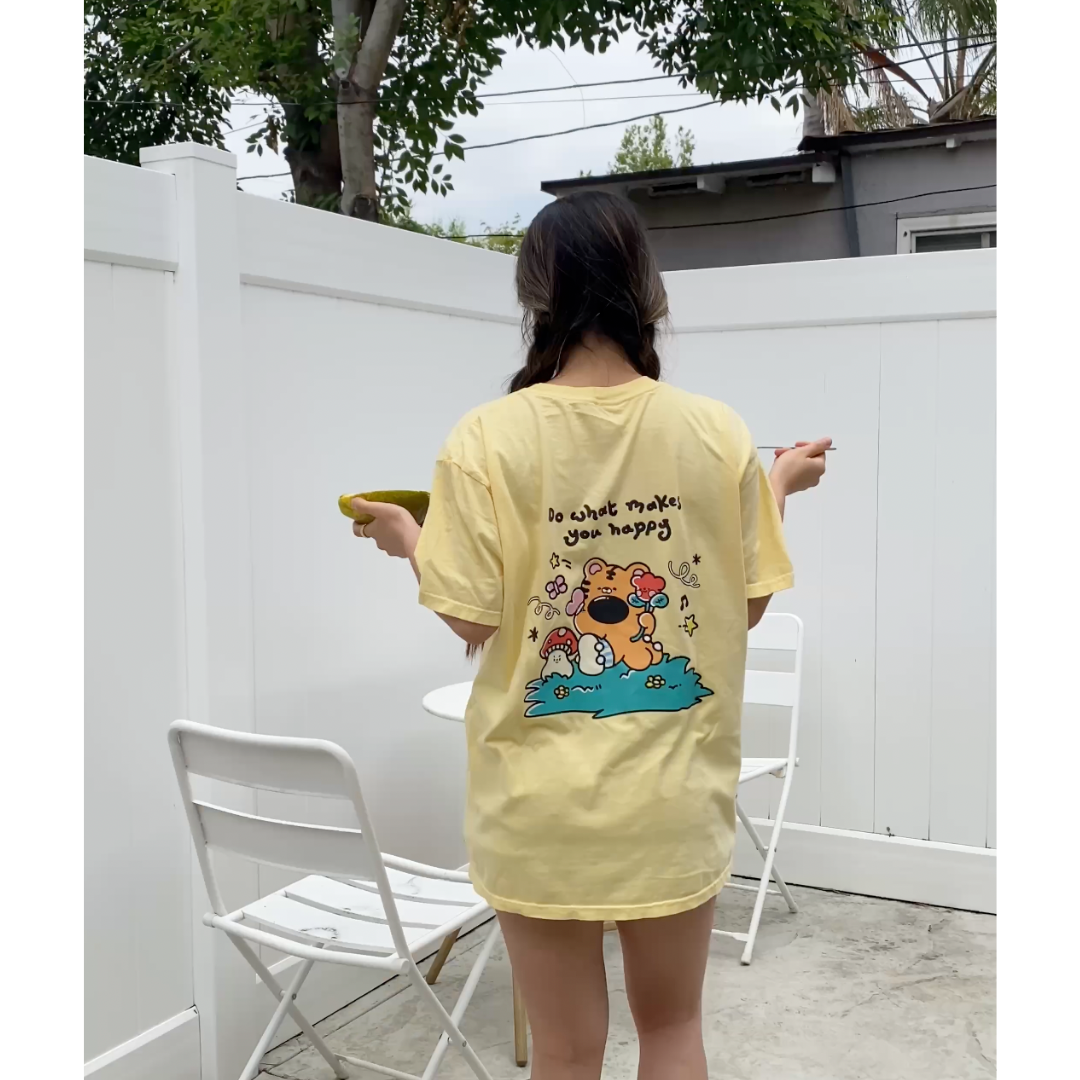 Relaxed fit butter yellow graphic tee with playful back illustration worn casually at home for everyday comfort