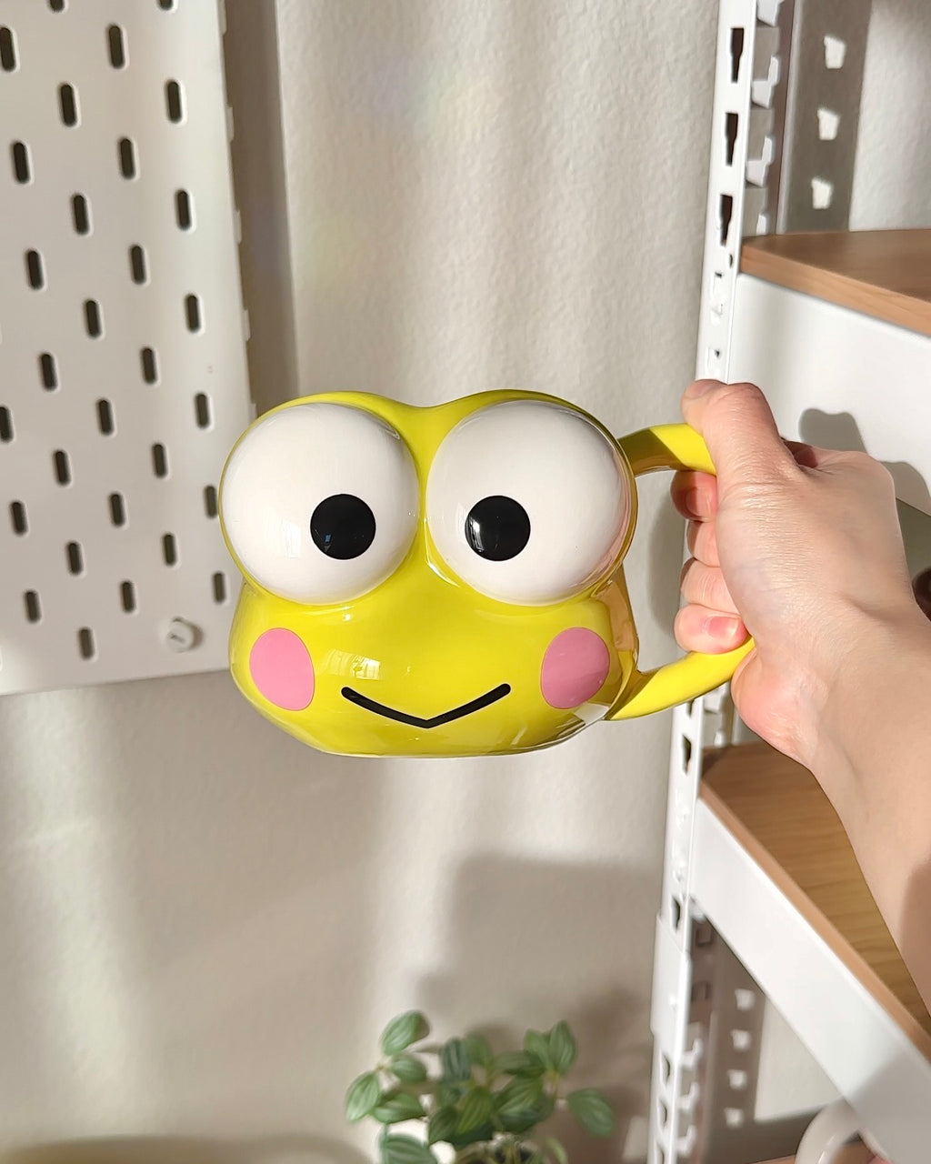 Front view of an officially licensed Sanrio Keroppi 3D sculpted ceramic mug with oversized eyes and glossy yellow finish, 20 oz capacity.