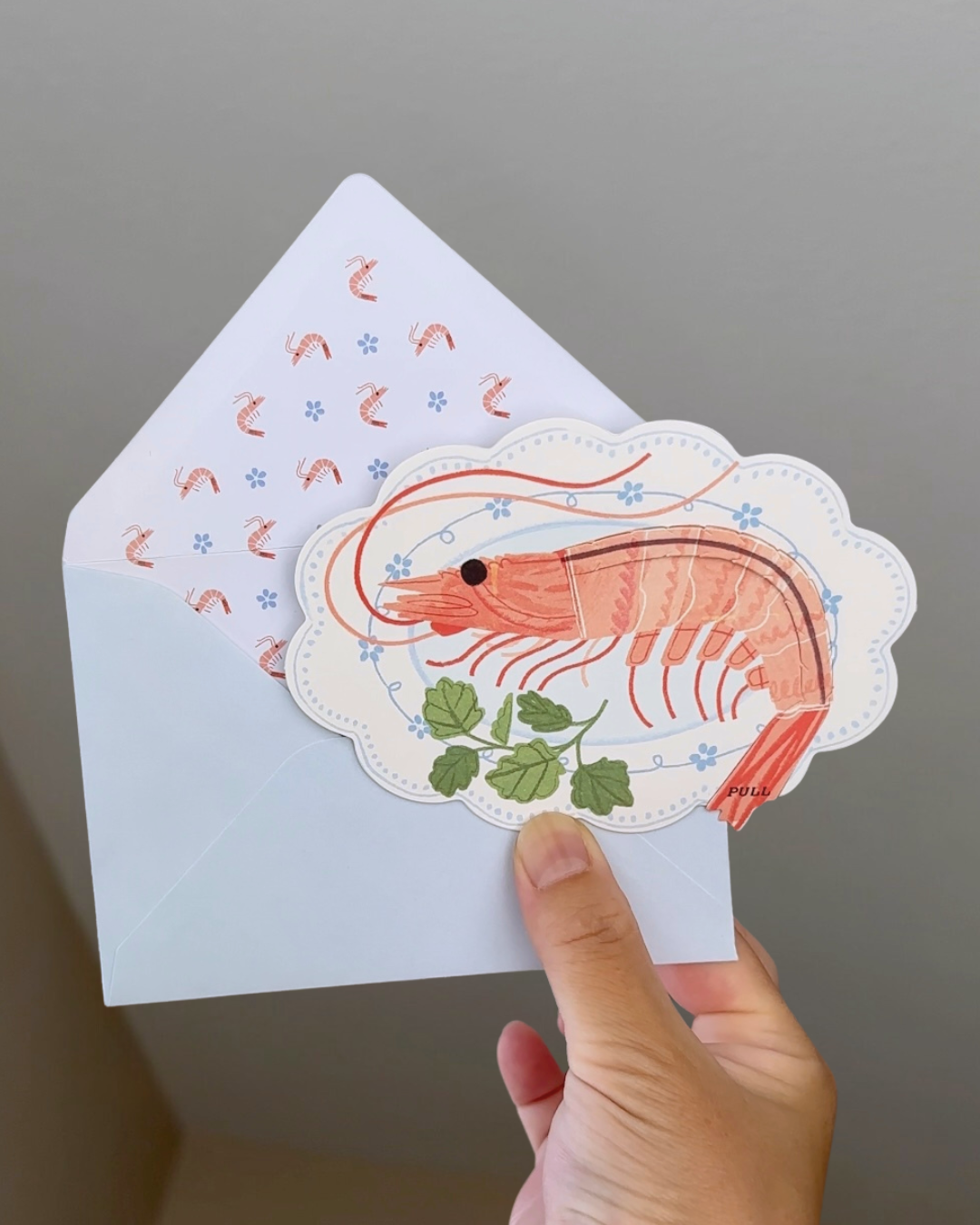 Funny shrimp greeting card with matching shrimp-pattern envelope.