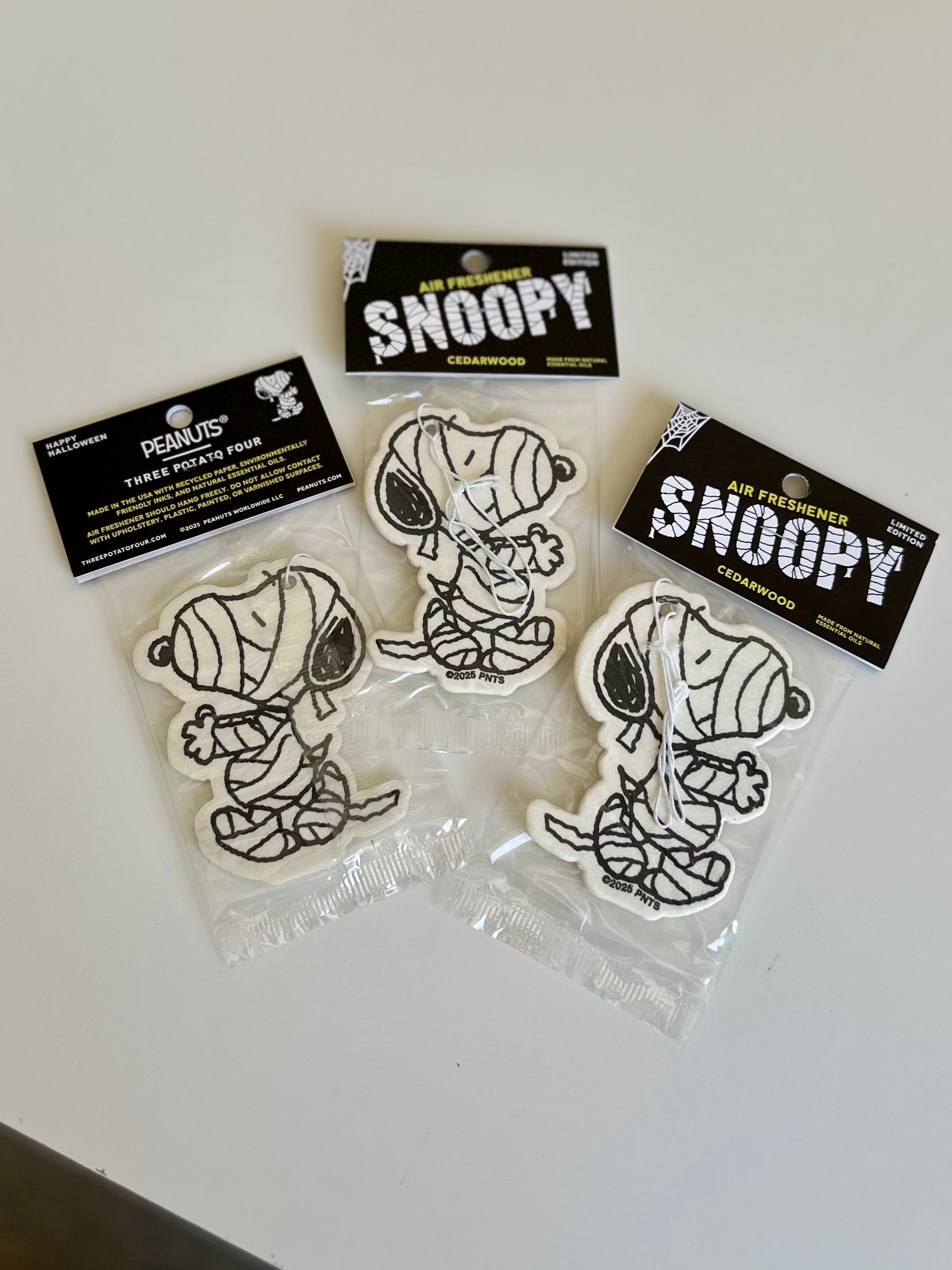 Snoopy cedarwood air fresheners featuring a Halloween mummy design