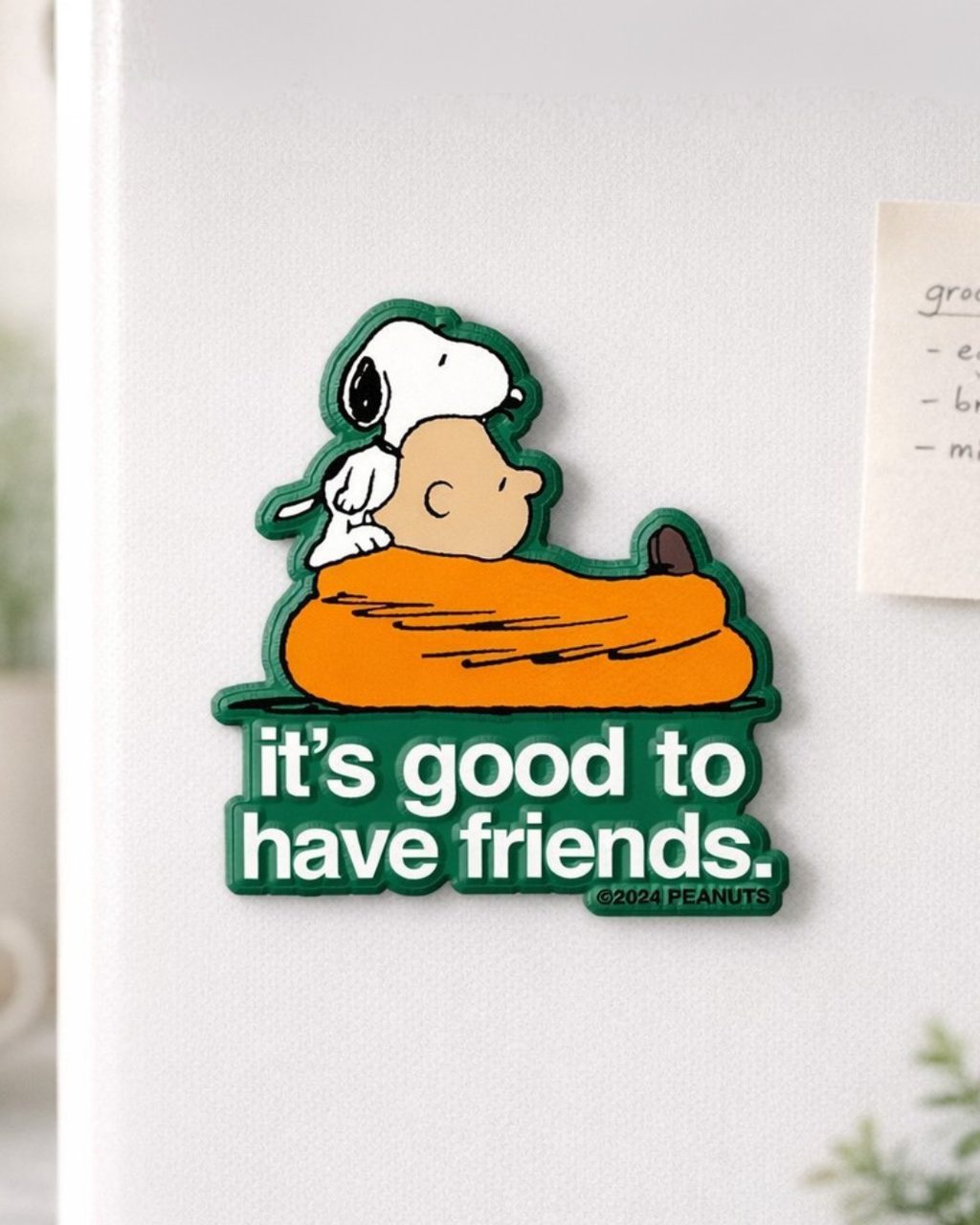 Snoopy and Charlie Brown “it's good to have friends” quote magnet on refrigerator door, Peanuts friendship magnet decor.