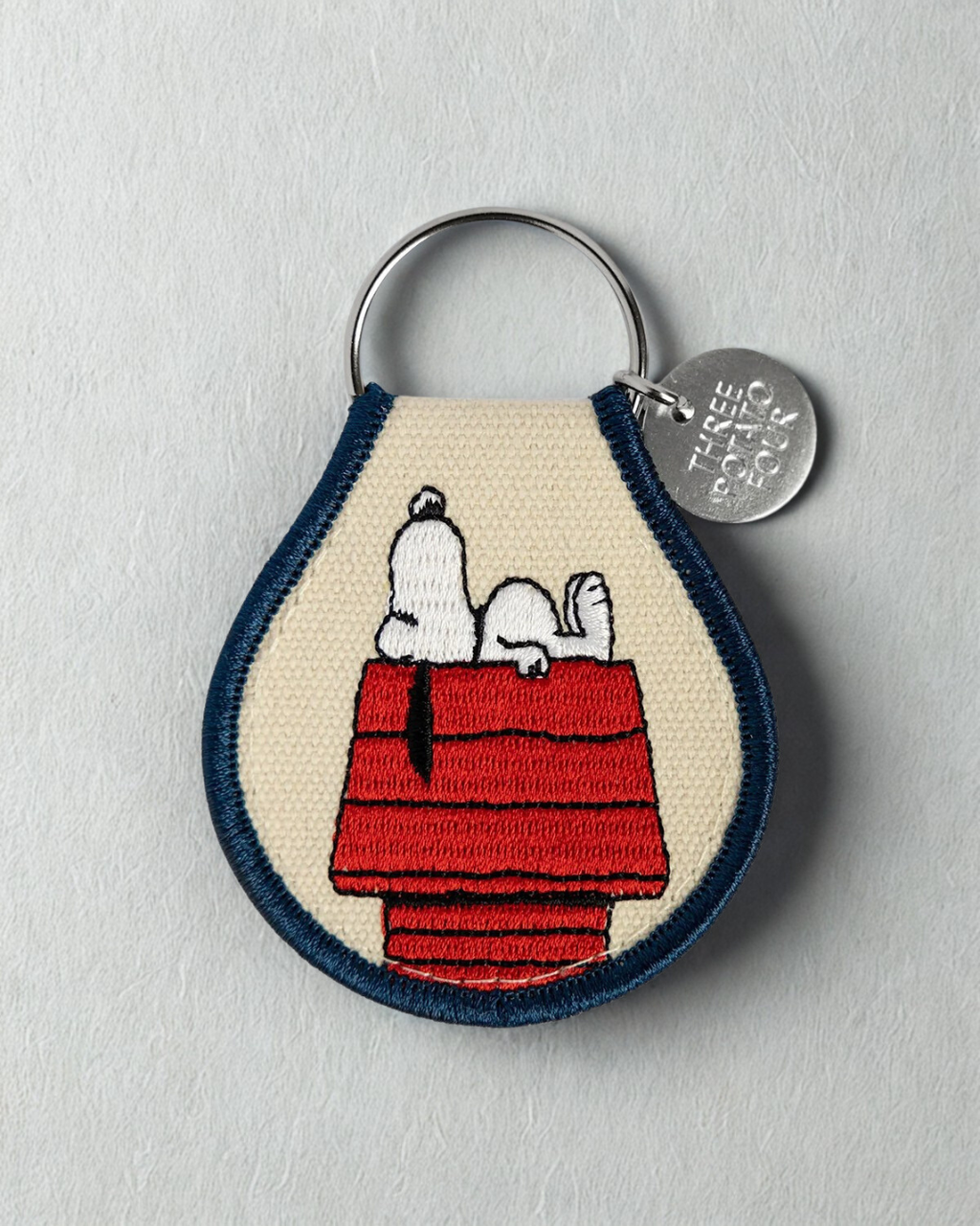 Embroidered Snoopy doghouse keychain inspired by Peanuts cartoon, cute Snoopy patch keychain bag charm accessory for backpack purse keys, Peanuts fan collectible gift