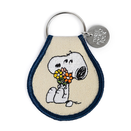 Snoopy embroidered keychain holding flowers – front view

