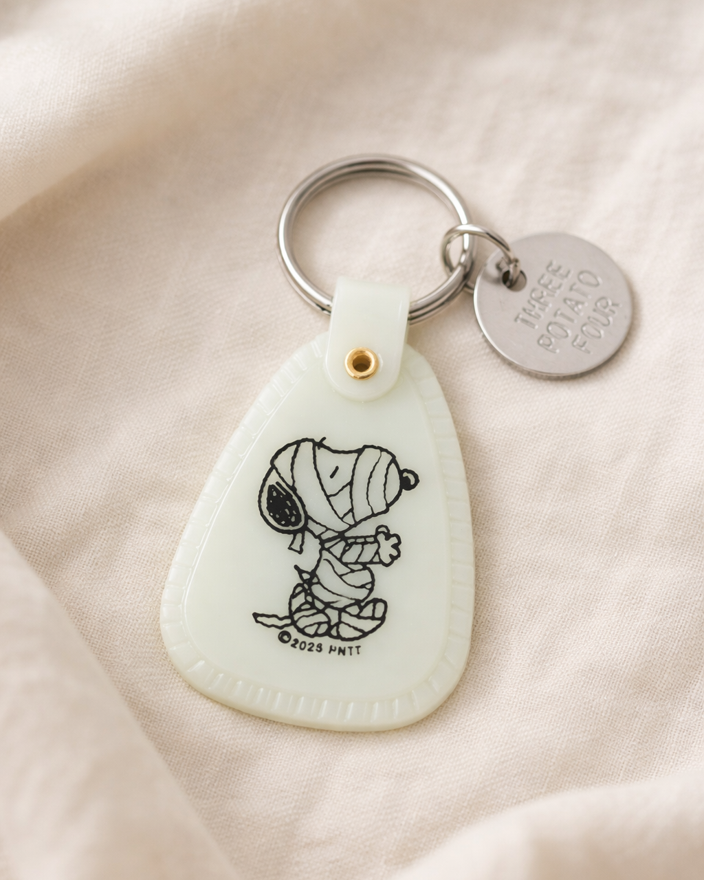 Glow in the dark Snoopy mummy keychain inspired by Peanuts cartoon, small saddle tag keychain bag charm accessory for keys backpack or purse, Halloween Snoopy collectible gift