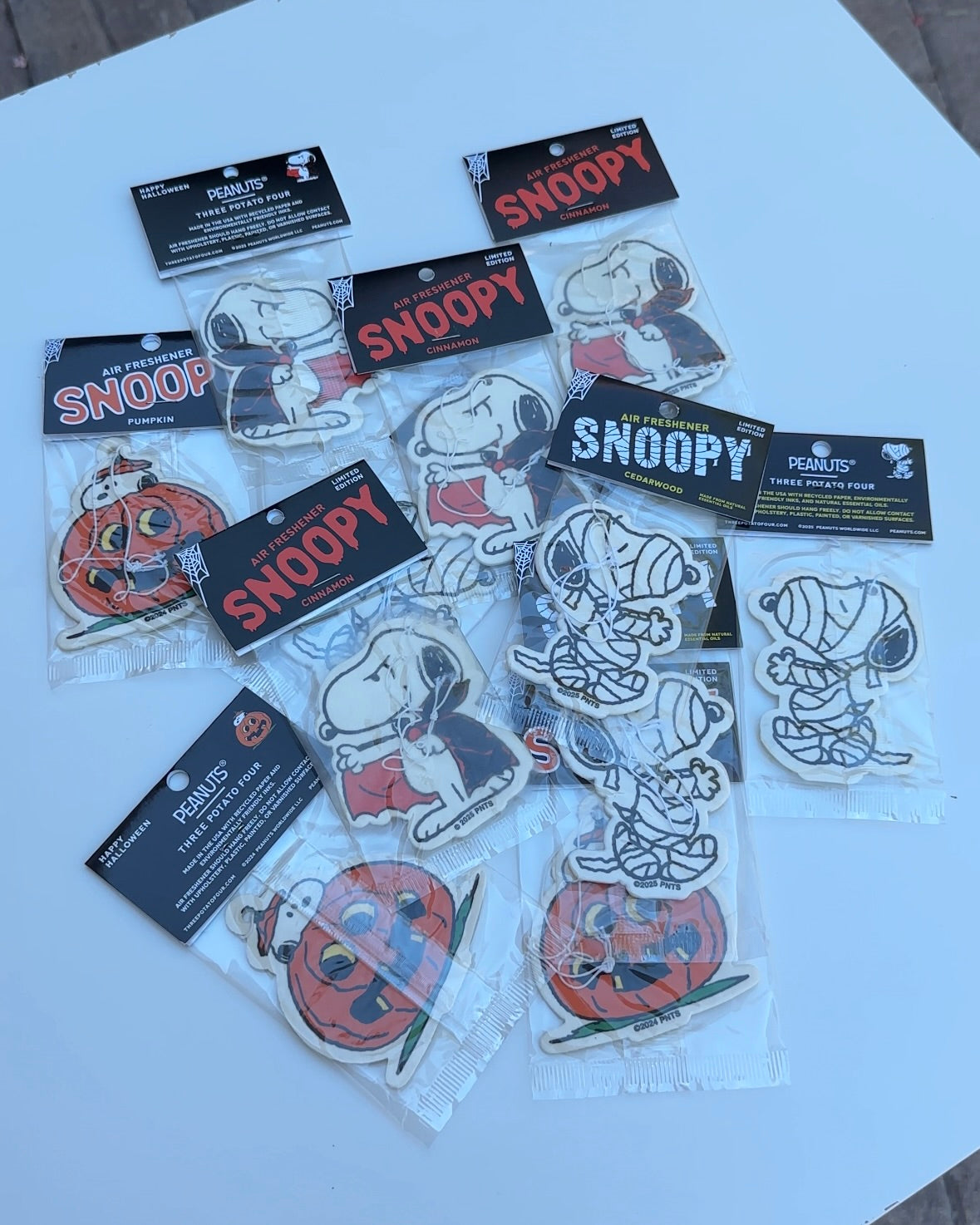 Assorted Snoopy Halloween air fresheners in festive designs, great for collectors, Peanuts fans, and Halloween enthusiasts.