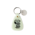 Glow-in-the-dark retro motel keychain featuring the phrase “Snoopy Spooky House – Enter if You Dare.” Halloween-themed key tag with silver key ring and charm, perfect for Peanuts fans and spooky season vibes.

