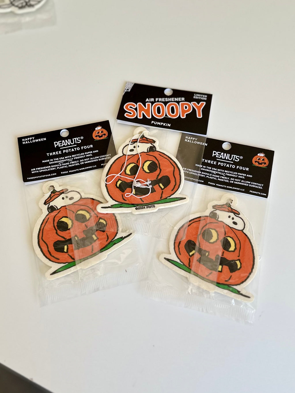 Limited edition Snoopy pumpkin air freshener featuring Snoopy peeking out from inside a carved jack-o’-lantern
