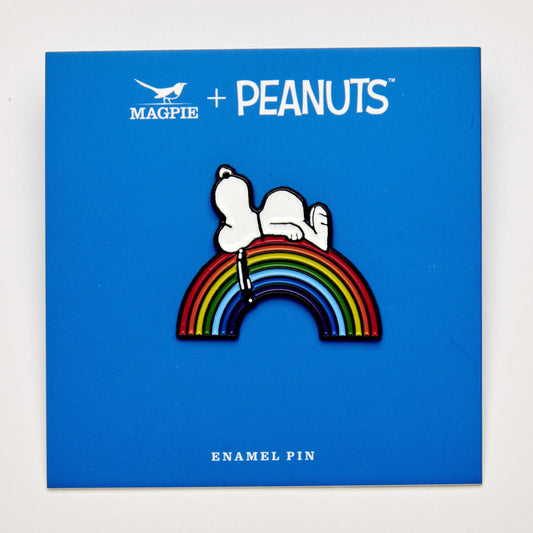 Snoopy enamel pin lounging on rainbow – Peanuts® Pride design