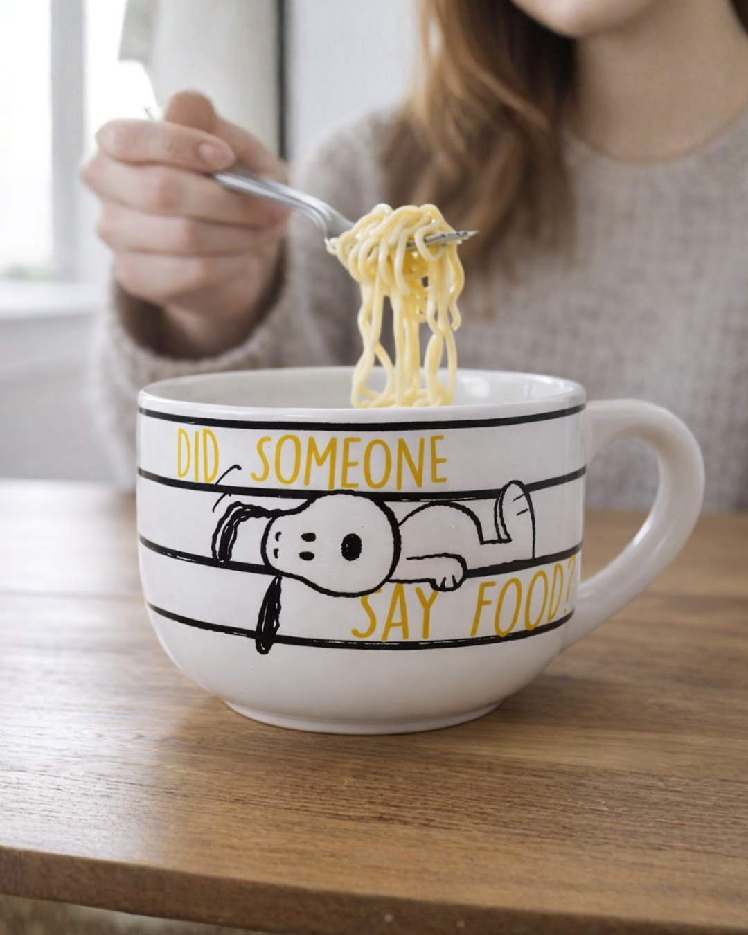 Snoopy ramen noodle bowl with cartoon Peanuts design being used to eat noodles, cute ceramic ramen bowl for noodles soup or ramen