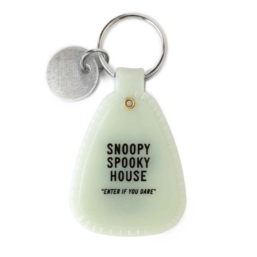Back view of Halloween Snoopy keychain showing Snoopy dressed as a mummy in black line art. Glow-in-the-dark plastic with Peanuts and Three Potato Four branding. A playful Halloween collectible for Snoopy lovers.




