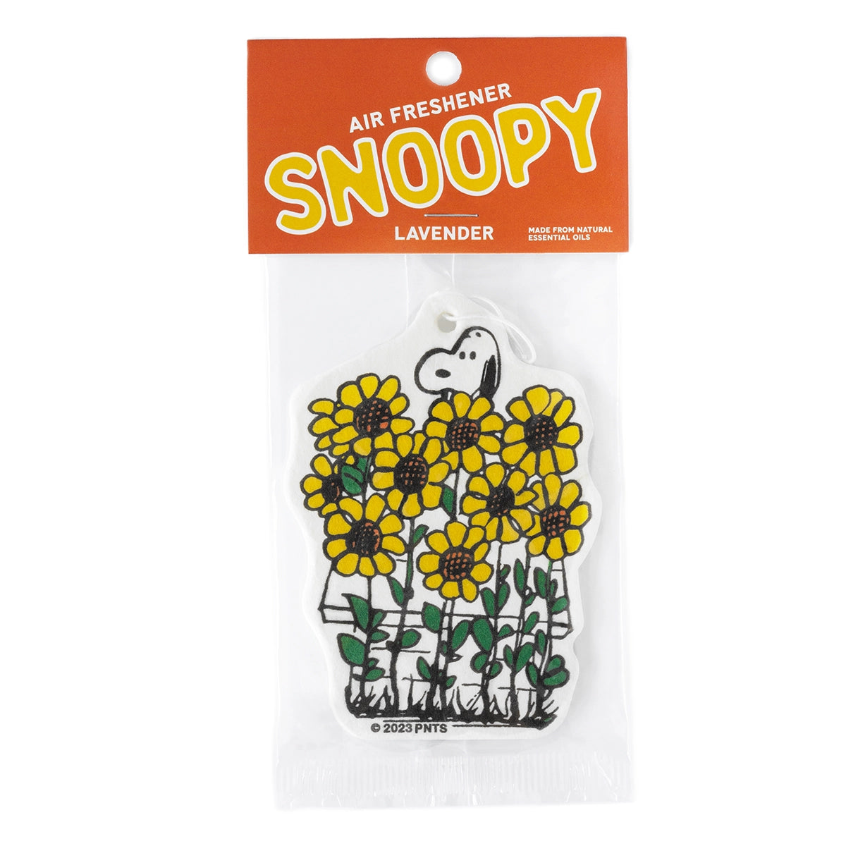 Close-up of Snoopy lavender air freshener in orange Peanuts packaging. Snoopy is peeking out from a patch of cheerful yellow sunflowers.