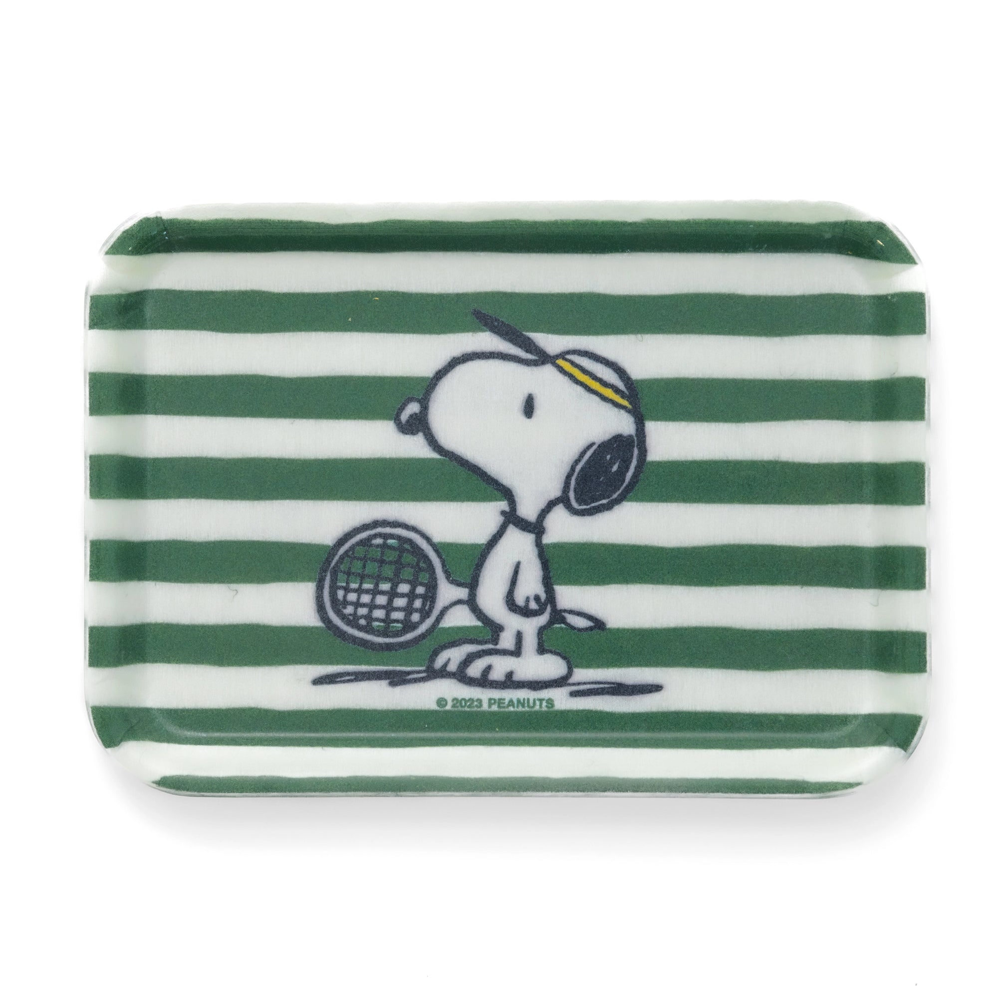 Small rectangular fiberglass tray featuring Snoopy in a tennis visor holding a racket on a green and white striped background. Lightweight and durable — perfect as a sporty catchall for keys, jewelry, or desk accessories.