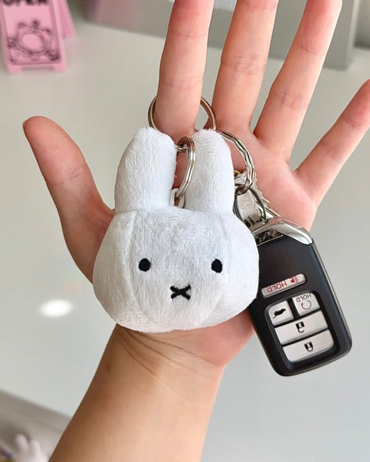 Soft mini Miffy plush keychain clipped to car keys