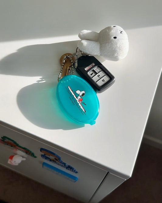 Snoopy coin pouch styled on keys with beachy aesthetic